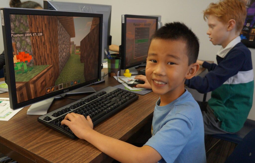 Child Playing Minecraft On A Computer