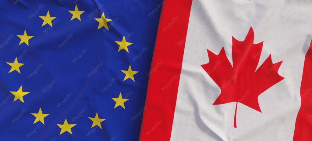 European Union And Canadian Flags Flying Side By Side